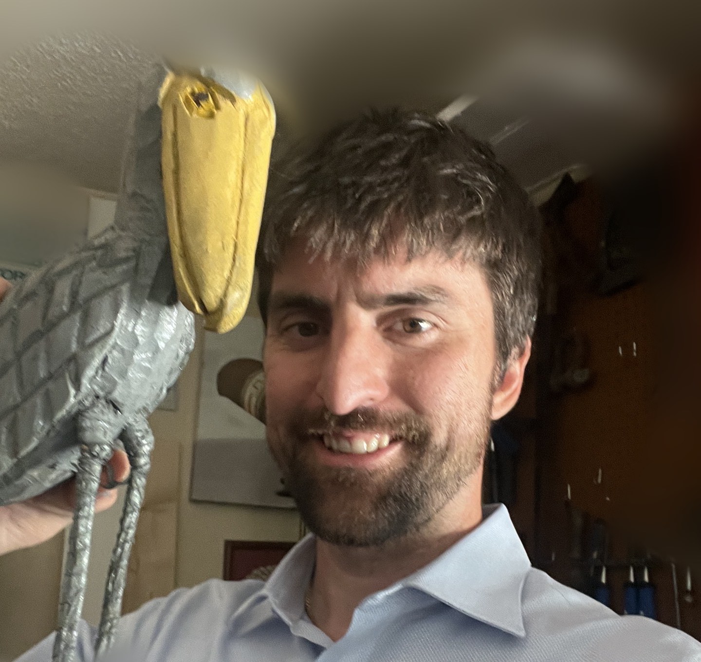 Ryan Burke, president of Friends of Save Shoebill, with a handmade Shoebill